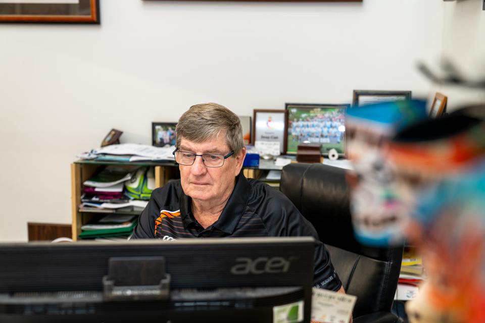 Rugby shop worker using computer