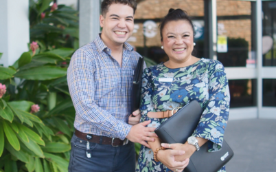 Man and woman holding folders